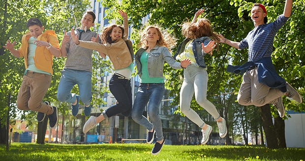 Students jumping and happy