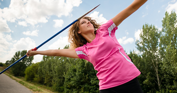 A girl getting ready to launch a javelin.