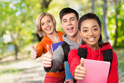 Students giving thumbs up