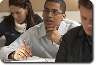 Teacher Writing on Blackboard