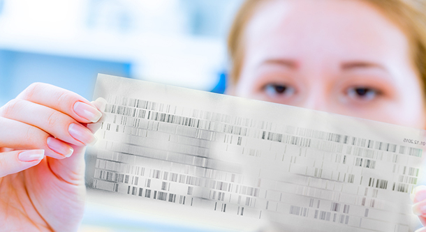 Woman scientist analyzing DNA