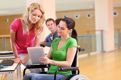 Students looking at a tablet