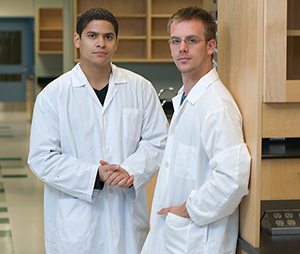 two scientists standing in a lab