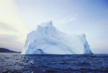 A glacier floating on water