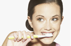 Woman brushing her teeth