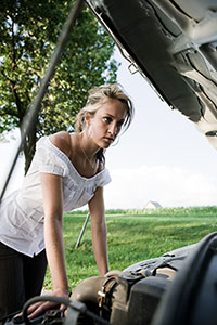 Girl fixing engine