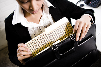 Woman looking in briefcase