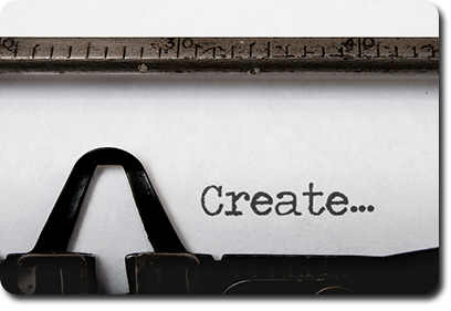 Typewriter with the word "create" typed on paper