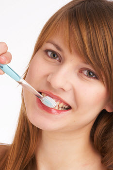 Girl brushing her teeth