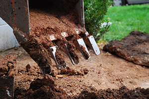 A loader extracting soil