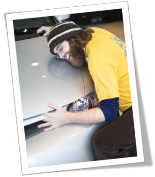 Photograph of man with new car