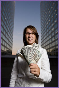 Image of woman holding money