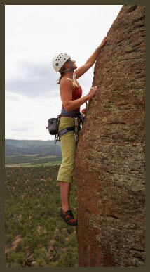 Image of woman rock climbing. 