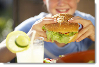 Image of girl holding hamburger