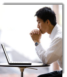 Image of man looking at computer