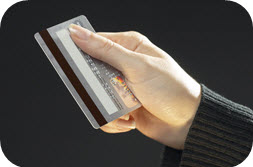 Image of hand holding credit card