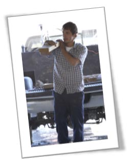 Image of young man working a construction site.