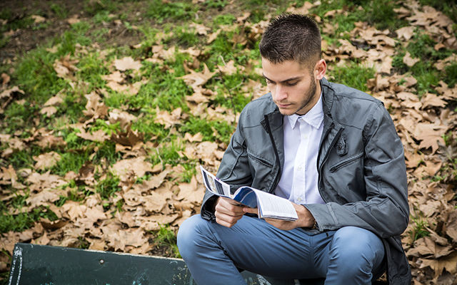 Student reading outside