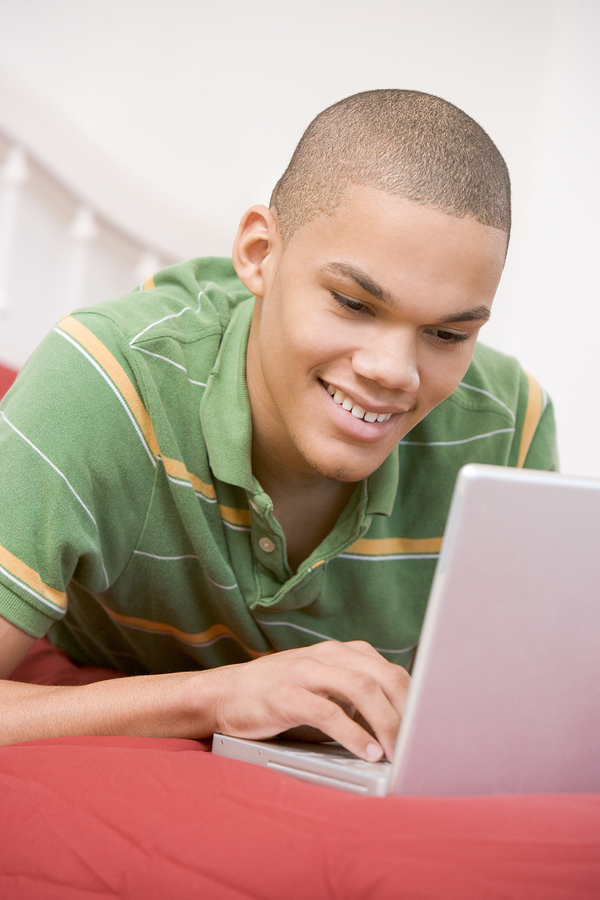 Teen boy on laptop