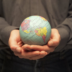 Person holding a globe