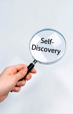 Magnifying glass over "self-discovery."