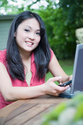 Girl on phone and computer