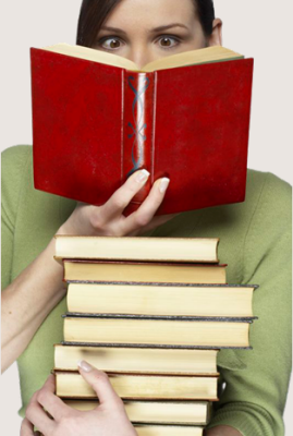 Woman reading books with a look of surprise