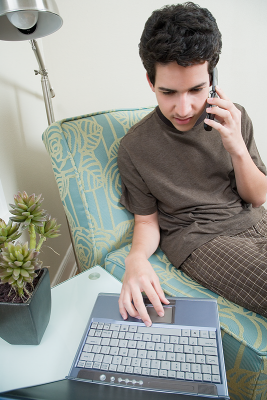 Student on phone and computer