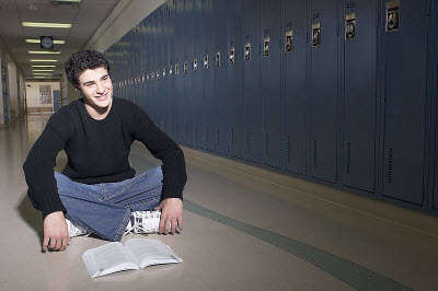 Student Reading by Lockers