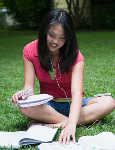 Girl with headphones reading