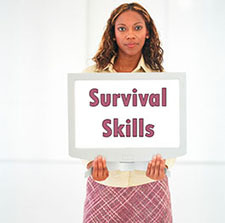 female student holding computer screen "survival skills"