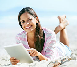 female student writing on tablet