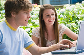 two students working at a computer