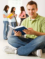 male student holding a book