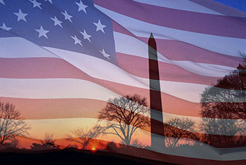 the American flag waving over the Washington Monument