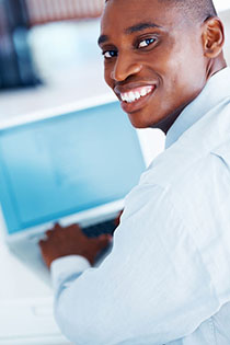 male student in front of a computer