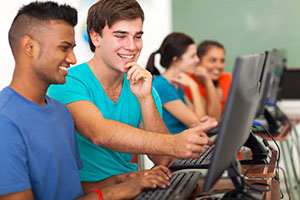 group of students looking at content on computers