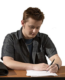 boy writing in journal