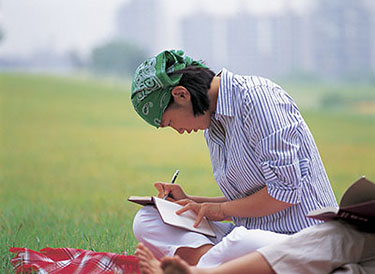 woman writing in journal