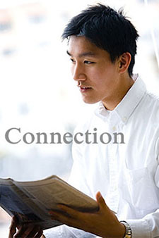 boy reading newspaper