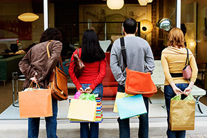 shoppers looking through store window