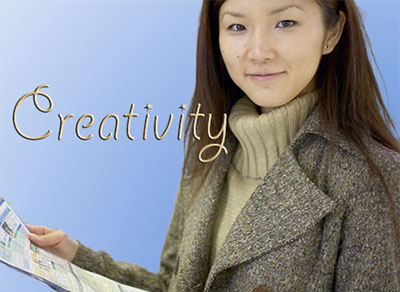 female student holding brochure "creativity"