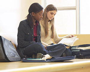 two female students studying together