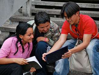 students looking at books