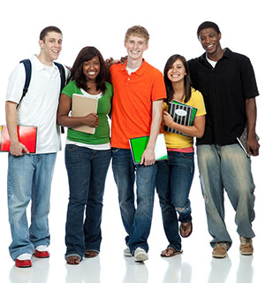 students holding books walking together