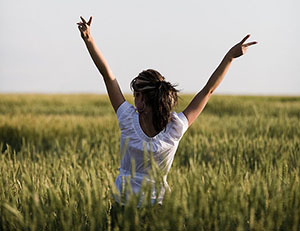 happy girl with her arms in the air