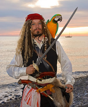 pirate with his parrot on a beach