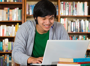 student researching in library