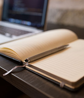 a pen resting on a book