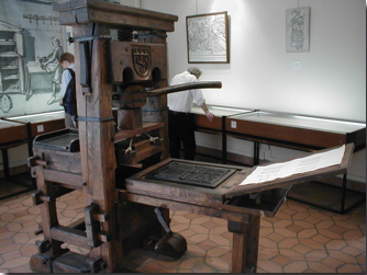 A reproduction of a Gutenberg-era Press on display at the 
Printing History Museum in Lyon, France